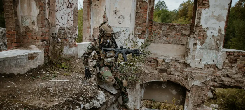 a couple of soldiers in a ruined building